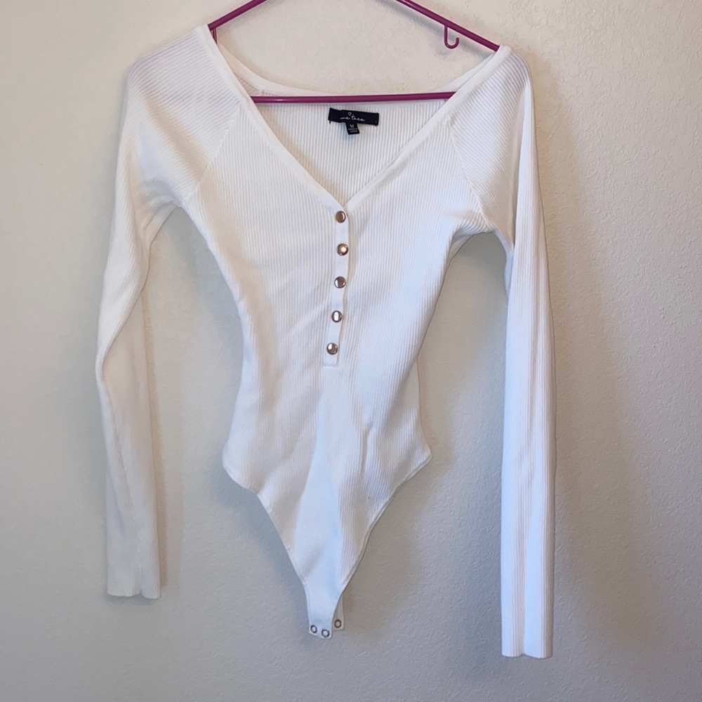 White long sleeve bodysuit.
